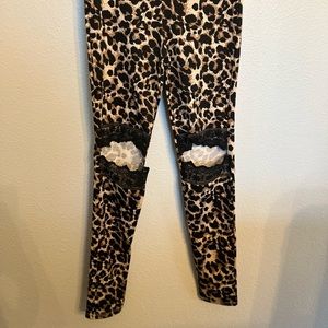 NWT Hayden leopard print leggings with cutout lace detailing.